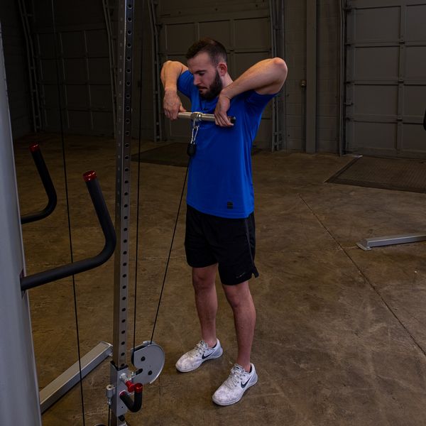 Man Using Body-Solid Aluminum Revolving Straight Bar