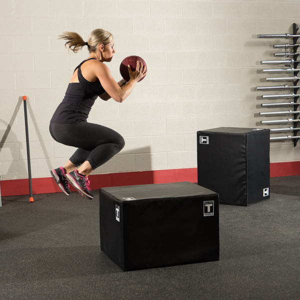 Woman Jumping Onto A Plyo Box