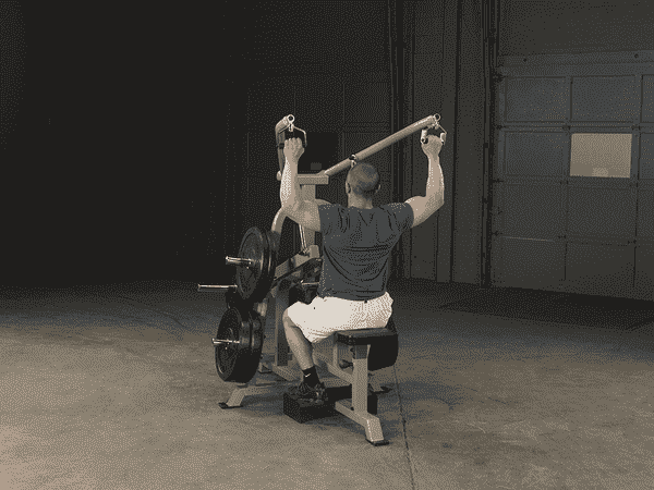 Man Using Body Solid Leverage Lat Pulldown Machine