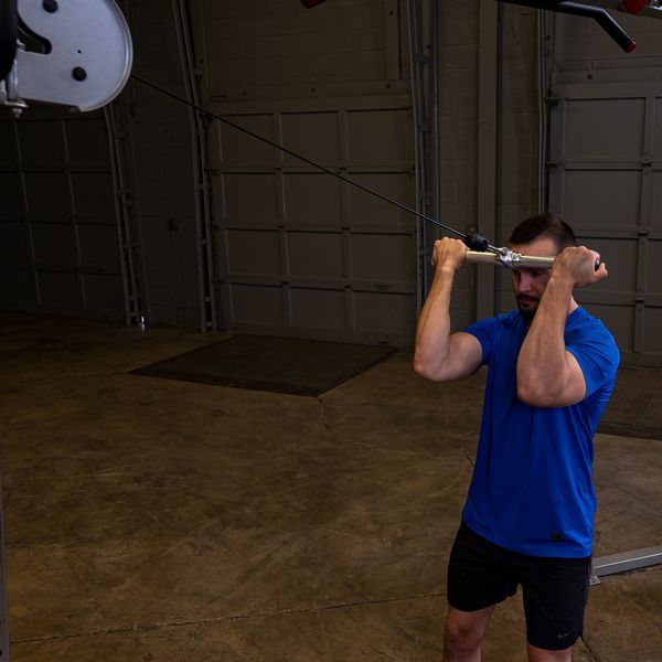Body-Solid Aluminum Revolving Straight Bar Being Used in a Workout