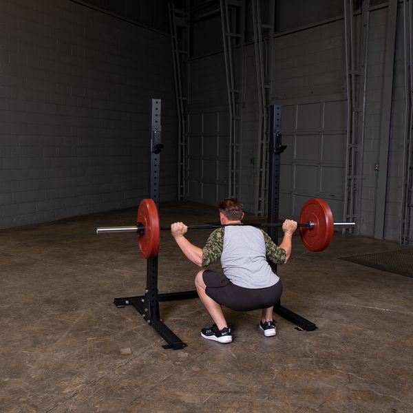 Man Lifting On A Commercial Squat Stand