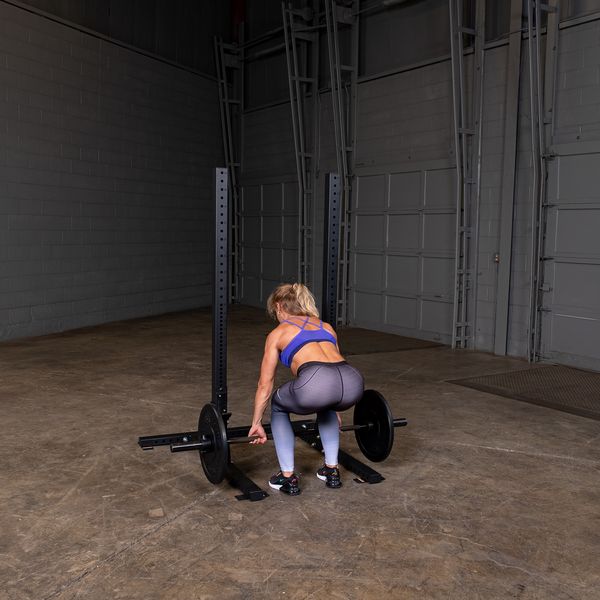 Woman Working Out With The Body Solid SPR250 Commercial Squat Stand