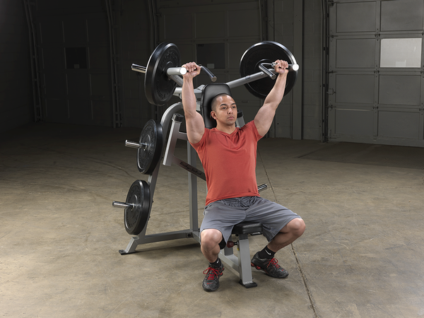 Man In A Gym Using A Body Solid Leverage Shoulder Press