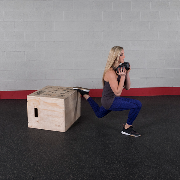 Woman Using The Body-Solid 3-in-1 Wooden Plyo Box